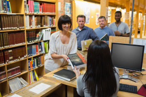 Librarian_checking_people_out_Depositphotos.com_wavebreakmedia_23050170_l